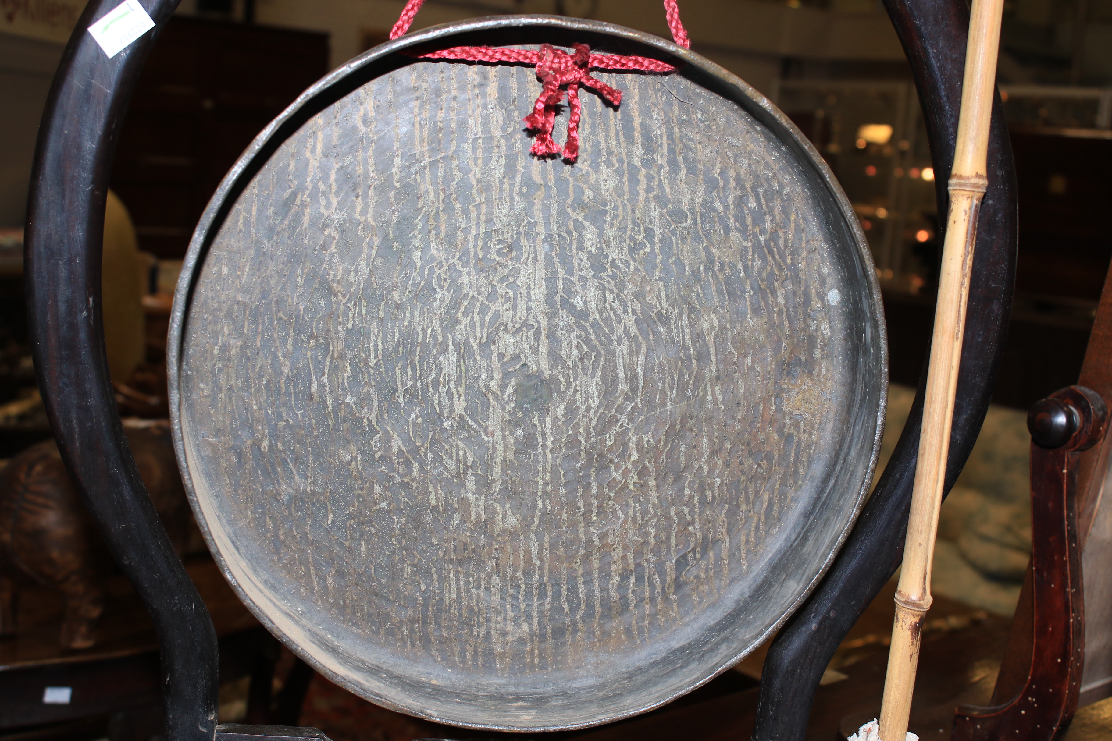 A Chinese gong raised on a carved ebonised stand. - Image 11 of 18