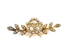 A late Victorian gold, half-pearl and diamond 'sweetheart' brooch.
