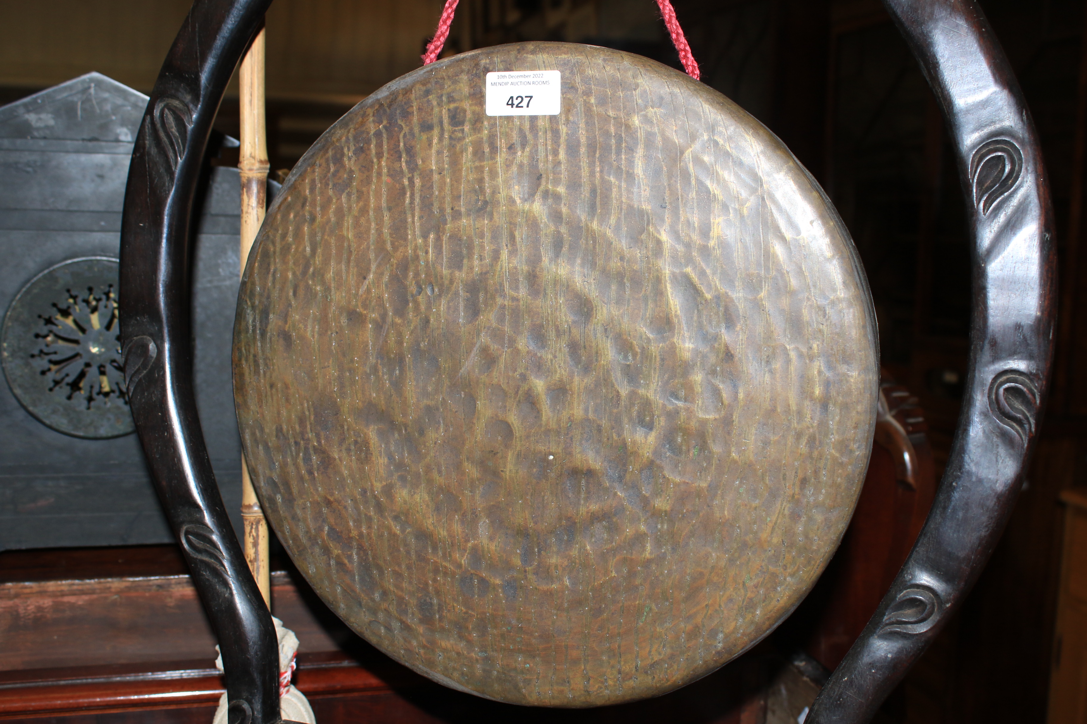 A Chinese gong raised on a carved ebonised stand. - Image 17 of 18