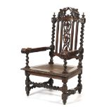 A 19th century carved oak caned hall chair.
