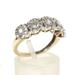 A diamond multi-cluster dress ring.