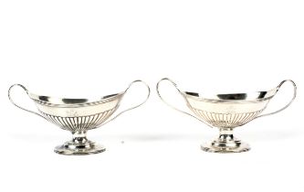 A pair of Victorian Regency style twin handled silver pedestal bowls.