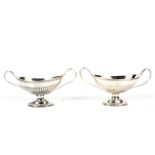 A pair of Victorian Regency style twin handled silver pedestal bowls.