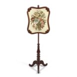 A Victorian mahogany rise and fall fire screen.