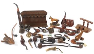 A large assortment of 20th century pipes and related items.