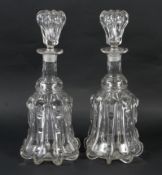 A pair of mid to late 19th century cut-glass decanters and stoppers.