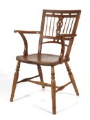 A Mendlesham (East Anglia) fruitwood Arts and Crafts style Windsor chair.