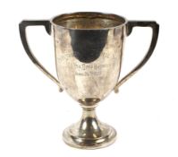 A silver twin handled pedestal trophy.