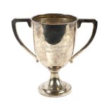 A silver twin handled pedestal trophy.