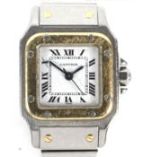 A vintage ladies Cartier Santos stainless steel and gold wristwatch.