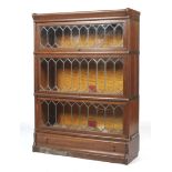 An early 20th century oak three tier sectional bookcase.