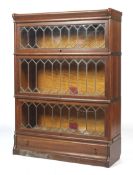 An early 20th century oak three tier sectional bookcase.