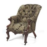 A Victorian oak framed button-back scroll armchair.