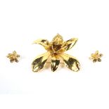 A Far Eastern gold-plated 'Orchid' brooch and matching stud earrings.