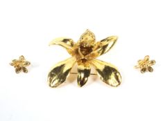 A Far Eastern gold-plated 'Orchid' brooch and matching stud earrings.