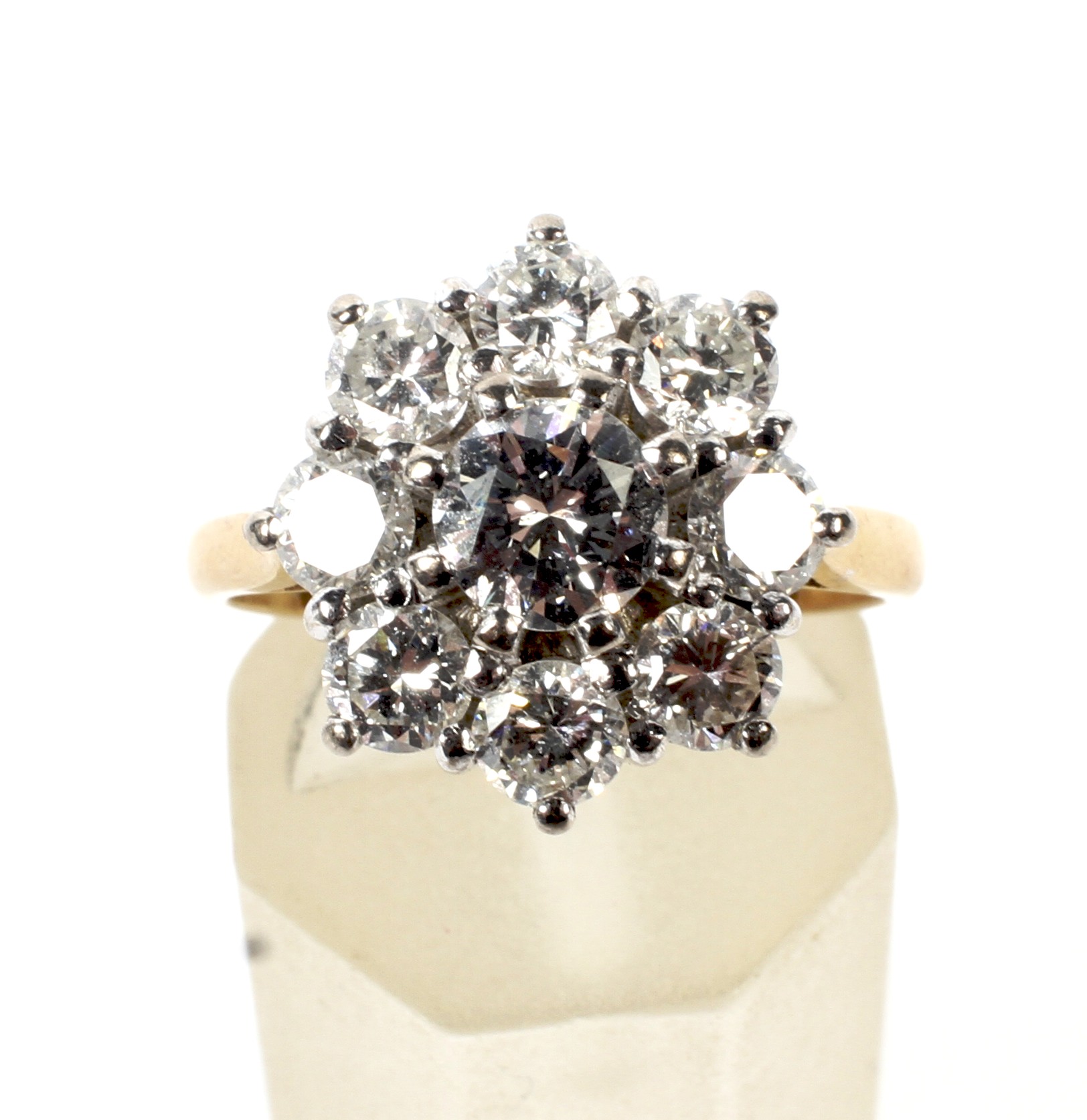 A vintage diamond nine stone cluster ring. Centred with a round brilliant diamond approx. 0. - Image 2 of 4