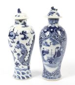 Two Chinese porcelain Qing Dynasty blue and white baluster shaped vases and covers.