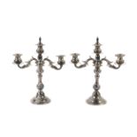 A pair of 20th century three sconce silver candelabra.