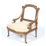 A 19th century French gilt wood upholstered fauteuil elbow chair.