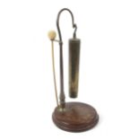 A Victorian rosewood brass mounted stand with later trench art style WWII shell case gong.