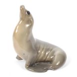 A Royal Copenhagen porcelain model of a seal. Printed blue and green marks, model no.