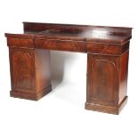 A Victorian mahogany twin pedestal breakfront sideboard.