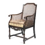 A 1930s bergere style elbow chair.