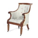 A 19th century Regency style upholstered library armchair.
