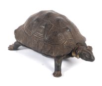 A 19th century gilt cast metal tortoise-shaped inkwell.