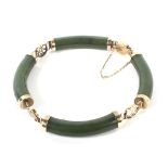 A Far Eastern yellow metal nephrite bracelet.