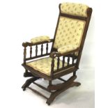 A 20th century mahogany rocking chair.