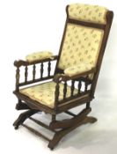 A 20th century mahogany rocking chair.