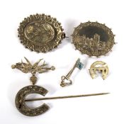 Six antique silver and white metal brooches. Including one designed as a horseshoe, 18.