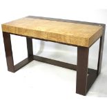 A retro maple wood veneered desk.