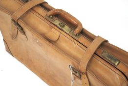 An American brown leather suitcase.