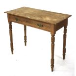 An Edwardian pine single drawer desk.