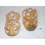 2 balinesische Holzmasken, H 26 cm, B 16 cm, teils beschädigt