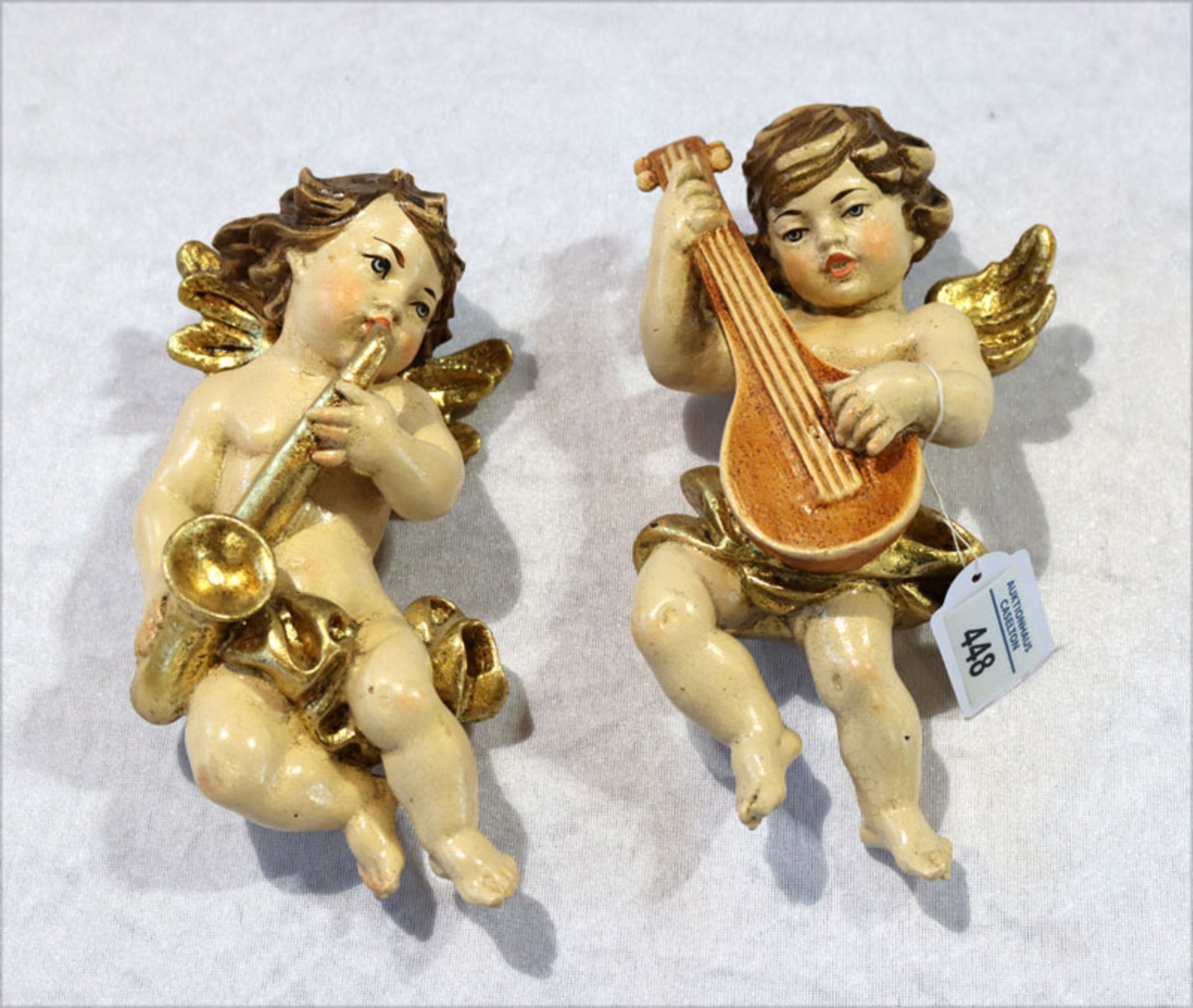 Paar Holzfiguren 'Musizierende Putten', farbig gefaßt, H 14 cm