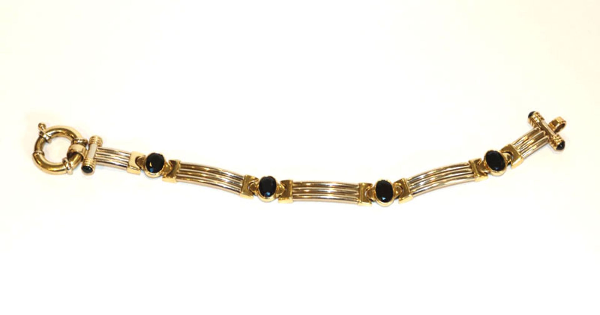 18 k Gelb- und Weißgold (geprüft) Armband mit 8 Safiren, 24,2 gr., L 18,5 cm