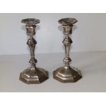 A pair of Queen Anne style silver candlesticks, of knopped octagonal form, detachable sconces -
