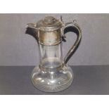 A late Victorian silver mounted glass claret jug of plain design on star cut base - London 1894,