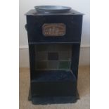 An antique Rippingilles stove, 16" high.