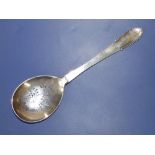 A Georg Jensen silver straining spoon with beaded edge handle, 9".