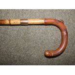 A Brigg walking stick with 12ct gold mounts initialled 'CHBP', London hallmarks for 1930, 37".