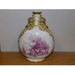 A 19thC porcelain moonflask shaped two-handled vase, painted puce panels depicting courting