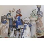 A set of four Lladro figure groups depicting the Four Seasons, the tallest 13" high - one missing