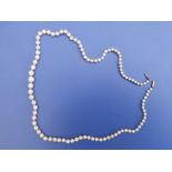 An Edwardian graduated cultured pearl nacklace, the largest 7mm, 18".