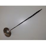 A Georgian toddy ladle with twisted whalebone handle, 16" - repair to handle joint.