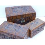 A set of three graduated carved 'Hong Kong' camphor boxes, the largest 11.5" across. (3)