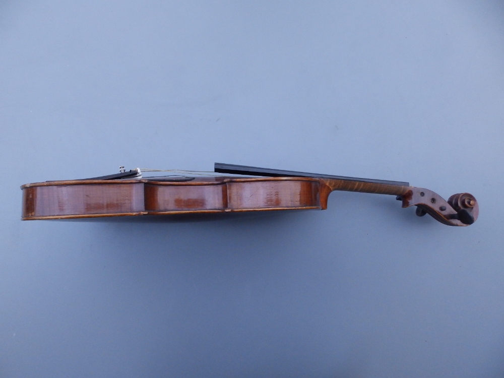 A Stradivarius copy violin by E R Schmidt & Co with 14.25" two piece back, together with two bows in - Image 10 of 12